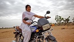  - in-rajasthan-school-teacher-on-motorcycle-ssa-250x166